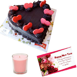 Heart shape cake with candle and card