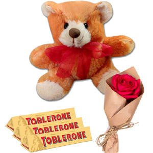 Teddy bear with chocolate and rose