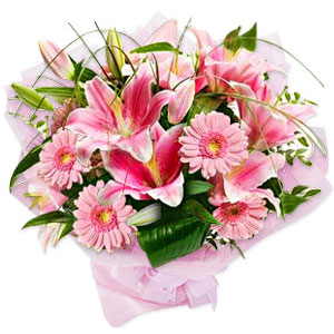 (16) Lilies W/ Gerbera in a basket